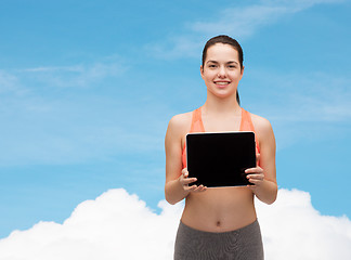 Image showing sporty woman with tablet pc blank screen