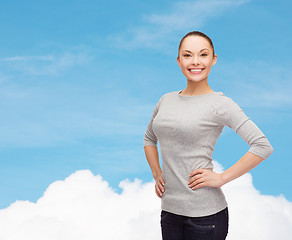 Image showing smiling asian woman over white background