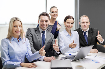 Image showing business team showing thumbs up in office