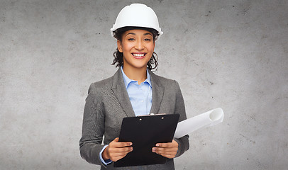 Image showing businesswoman in white helmet with clipboard