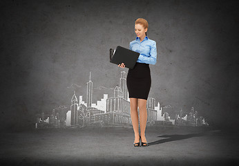 Image showing smiling businesswoman with folder