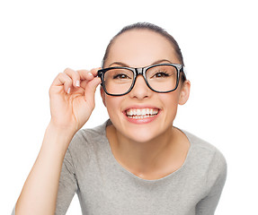 Image showing asian woman in adjusting eyeglasses