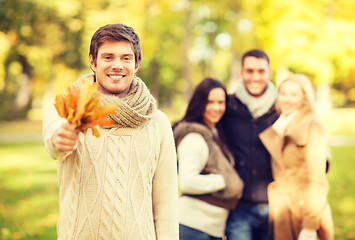 Image showing group of friends having fun in autumn park