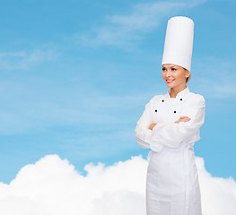 Image showing smiling female chef with crossed arms