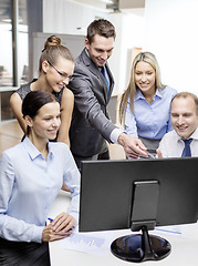 Image showing business team with monitor having discussion