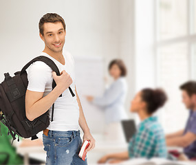 Image showing travelling student with backpack and book