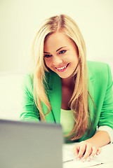 Image showing businesswoman with laptop in office