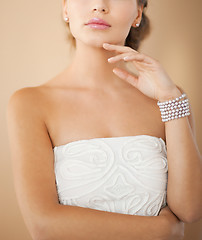 Image showing woman with pearl earrings and bracelet