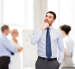 Image showing handsome businessman looking up