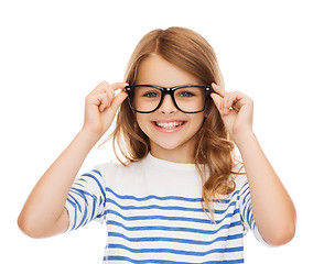 Image showing smiling cute little girl with black eyeglasses