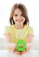 Image showing little girl holding green paper house