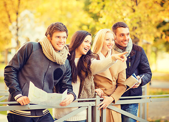 Image showing couples with tourist map in autumn park