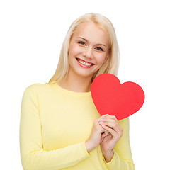 Image showing smiling woman with red heart