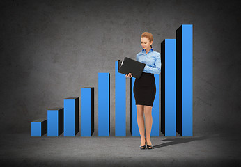 Image showing smiling businesswoman with folder