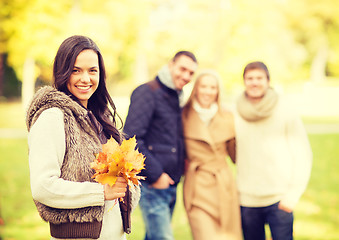 Image showing group of friends having fun in autumn park