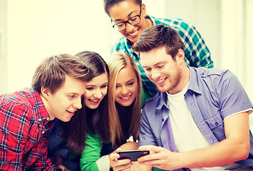 Image showing students looking at smartphone at school