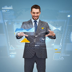 Image showing businessman working with virtual screen