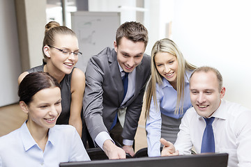 Image showing business team with monitor having discussion