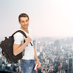 Image showing travelling student with backpack and book