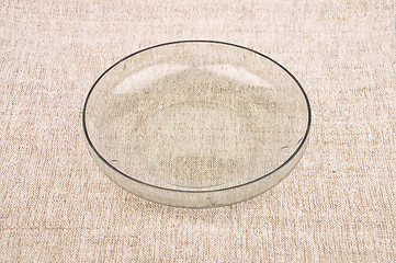Image showing Bowl of glass on linen
