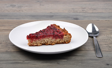 Image showing Red currant cake on wood