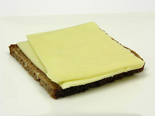 Image showing Wholemeal bread with two slices of cheese on a plate 