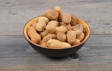 Image showing Peanuts on wood