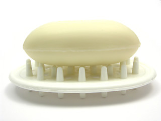 Image showing Beige soap on a soap dish on white background