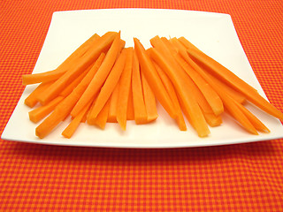 Image showing Julienne carrots on a white plate and checked placemat