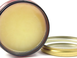 Image showing Yellow hair wax in a little open glass with lid