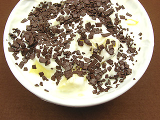 Image showing Pieces of pineapple in yogurt and and a white bowl of chinaware