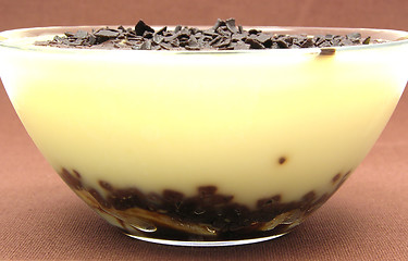 Image showing Custard with banana and chocolate graters in a bowl of glass