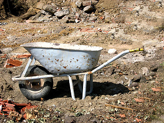 Image showing Cutout with a hand barrow on a site