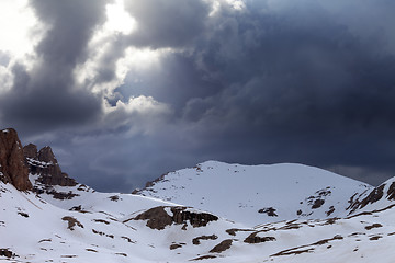 Image showing Snowy mountains and storm clouds