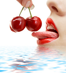 Image showing cherry, lips and tongue in water