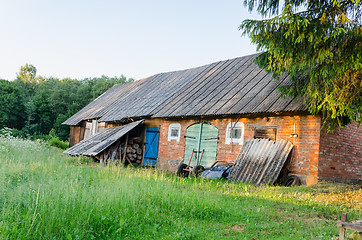 Image showing old outbuilding with colored doors rural meadow 