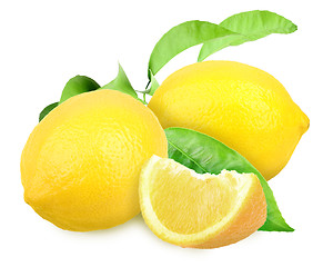 Image showing Fresh yellow lemons with green leaf