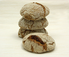 Image showing Home made wholemeal vinschgauer buns on beige underlay