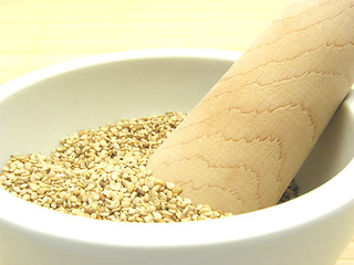 Image showing Sesame in a bowl of china ware with pestle