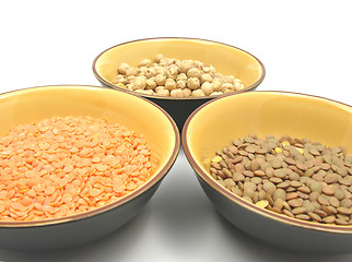 Image showing Three bowls of ceramic with garbanzos lentils and red lentils