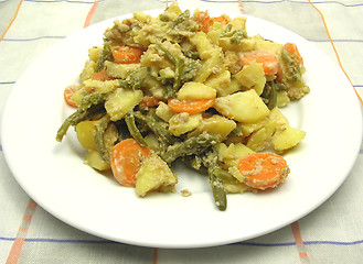 Image showing Vegetarian vegetable casserole on a white plate and checked tabl