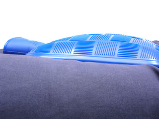 Image showing Blue hot-water bag on a blue pillow