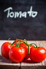 Image showing fresh tomatoes and blackboard