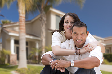 Image showing Happy Hispanic Young Couple in Front of Their New Home