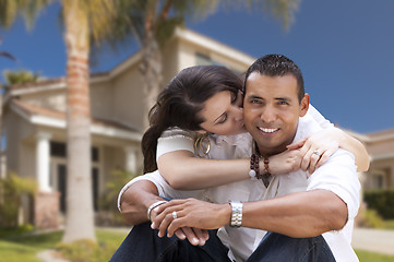 Image showing Happy Hispanic Young Couple in Front of Their New Home