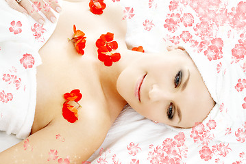 Image showing red flower petals spa with flowers