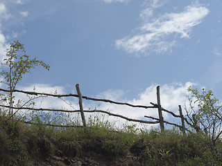 Image showing Sky, clouds and old wooden fence