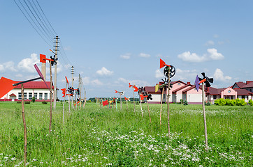 Image showing Hand made pinwheel collection spin in wind 