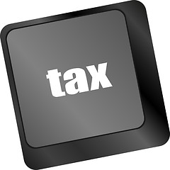 Image showing tax word on laptop keyboard key, business concept,