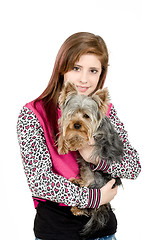 Image showing smiling young girl with her pet yorkshire